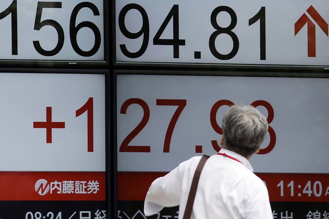 La Bourse de Tokyo a terminé sur une note positive pour la cinquième séance consécutive. © KEYSTONE/AP/EUGENE HOSHIKO