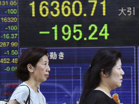 L'indice vedette Nikkei a légèrement reculé mardi à la Bourse de Tokyo (archives). © KEYSTONE/AP/KOJI SASAHARA