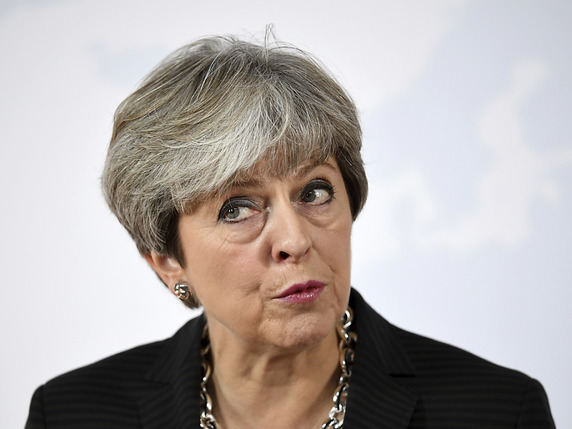 Theresa May a annoncé qu'elle voulait que les tribunaux britanniques "prennent en compte" les jugements de la Cour de justice de l'UE dans leurs décisions concernant les droits des citoyens européens après le Brexit. © KEYSTONE/AP Getty Images Europe/JEFF J MITCHELL