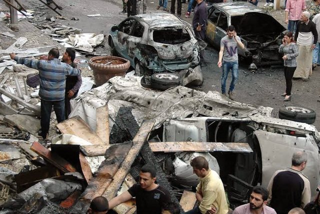 Attentat à la voiture piégée à Homs (Im. archive: 14 avril 2014).