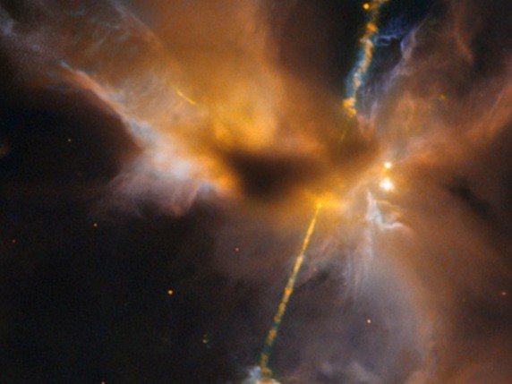 Naissance d'une étoile dans la constellation d'Orion vue par le télescope spatial Hubble: notre jeune soleil ressemblait peut-être à cela, projetant de la matière et du rayonnement dans le cosmos. © EPFZ/NASA/ESA