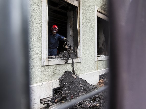 Au total, l'incendie a fait sept morts, dont trois enfants. © KEYSTONE/ALEXANDRA WEY