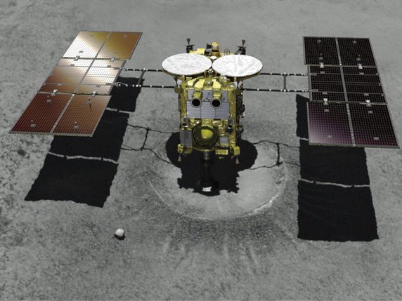Image de synthèse montrant la sonde Hayabusa2 s'approcher de l'astéroïde Ryugu. © KEYSTONE/AP JAXA