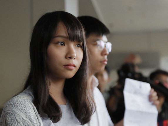 Joshua Wong (droite) et Agnes Chow © KEYSTONE/AP/Kin Cheung